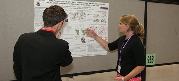 Students discussing research poster at BMES Seattle 2013