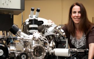 Lara Gamble, research associate professor of bioengineering, with lab equipment