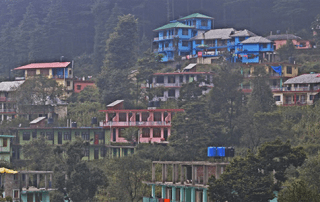 Houses on mountainside in India