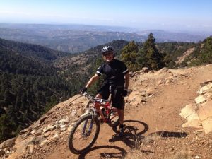 UW Bioengineering associate professor Mike Averkiou mountain biking on trail