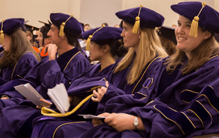 Bioengineering PhD graduates wearing graduation regalia