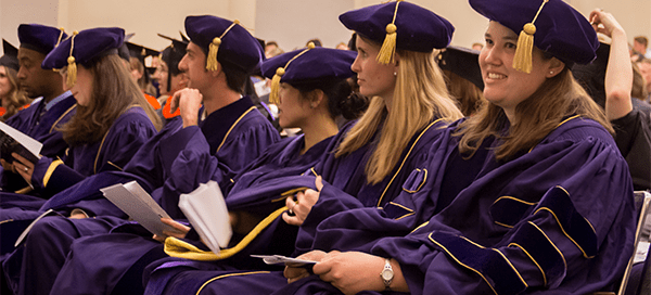 Bioengineering PhD graduates wearing graduation regalia