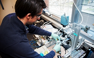 Student working on bioengineering laboratory equipment and devices