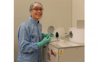 Sharon Newman in a cleanroom with silicon wafers holding the first few layers of her electrodes. They are about to be deposited with a few nanometer thick layer of SiC via the PECVD (Plasma-enhanced chemical vapor deposition) machine shown.
