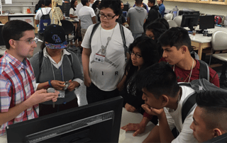 BioE student leading discussion with high school students