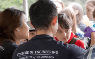 Undergraduate seniors Drew Matsuura and Christine Yoo demonstrate the DNA Strawberry Extraction module.