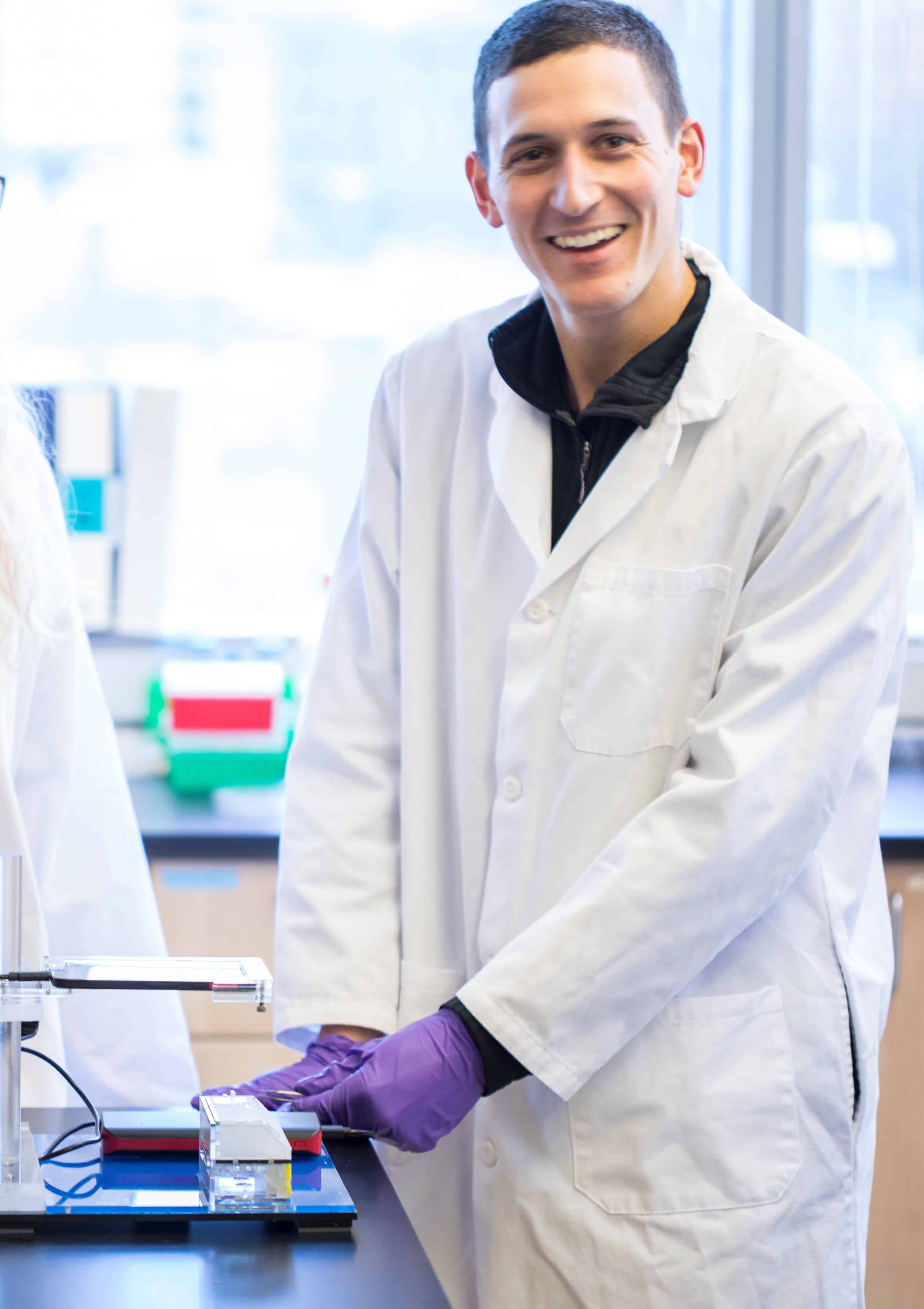 UW master's student Dylan Guelig in lab