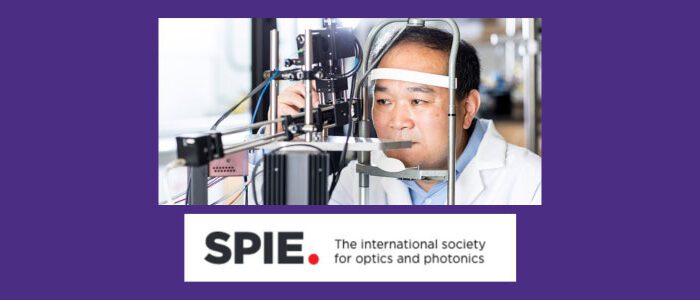 Ruikang Wang, a Professor of Bioengineering and Ophthalmology at the University of Washington, using a piece of lab equipment