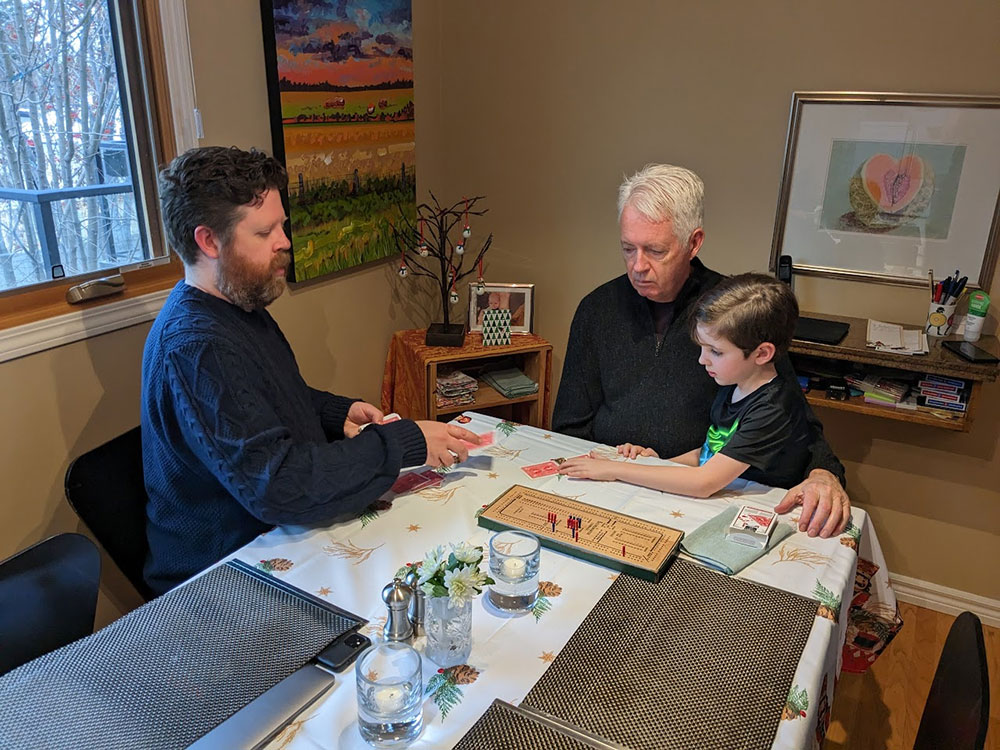 Boyle plays cribbage with his father and son, Clare