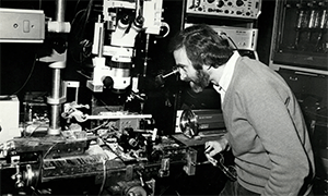 Archival photo of researcher working with instrument